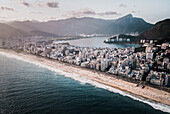 Aerial View Of Afternoon Light Shining Upon Rodrigo De Freitas Lagoon And Ipanema Beach With Christ The Redeemer In Background,Rio De Janeiro,Brazil