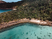 Aerial view of a person on a stand up paddle board at South Whitehaven Beach,Queensland,Australia
