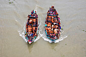 Narayanganj,Bangladesh - 19 July 2021: Aerial view of cattle squeezed on a boat crossing the river in Narayanganj,Bangladesh