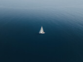 Aerial view of a sailing boat in Tindari bay,Sicily,Italy