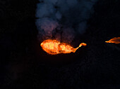 Aerial view of a lava explosion and the fog in Iceland