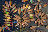 Aerial view of Hundreds of wooden boats fan out around their moorings in patterns which resemble flower in Buriganga river,Dhaka,Bangladesh