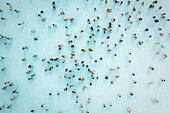 Aerial view of people doing a bath in a huge pool,Sicily,Italy