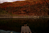Aerial view of Lake Argyle at sunset with people and raft,Western Australia,Australia