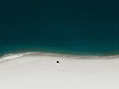 Aerial view of an umbrella on a white beach,Sicily,Italy