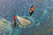 Badalgachhi,Bangladesh - 30 January 2021: Aerial view of fishermen on a canoe sailing the Jamuna river,Bangladesh