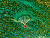 Aerial view of fishermen on a canoe sailing the Jamuna river,Bangladesh