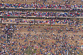 Aerial view of a large congregation of people for a muslim festival on the top of trains at train station in Dhaka,Bangladesh