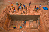 Dhamrai,Bangladesh - 26 March 2019: Aerial view of a few people working in a brick factory,Dhaka province,Bangladesh