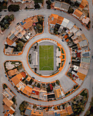 Aerial view of a football pitch surrounded by houses in a circle,Poggioreale,Sicily