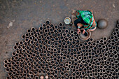 Sahajanpur,Bangladesh - 19 December 2021: Aerial view of a person working with clay pots in a factory,Bangladesh