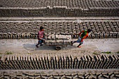 Dhamrai,Bangladesh - 26 March 2019: Aerial view of a few people working in a brick factory,Dhaka province,Bangladesh