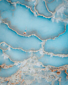 Aerial view of a person watching out from a hot spring terrace,Saturnia,Tuscany