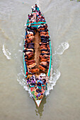 Narayanganj,Bangladesh - 19 July 2021: Aerial view of cattle squeezed on a boat crossing the river in Narayanganj,Bangladesh