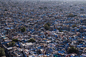 Aerial view of the vibrant blue cityscape with traditional architecture and densely populated rooftops,Jodhpur,India