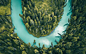 Aerial view of a river crossing the forest near Verkh-Uymonskoe,Altai region,Russia