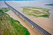 Aerial view of Padma bridge,over the padma river by day in lateral perspective,Shibchar,Dhaka,Bangladesh