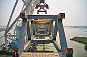 Aerial view of a building site while assembling the Padma bridge,the longest rail and highway bridge in Bangladesh crossing the Padma river,Zajira,Dhaka,Bangladesh