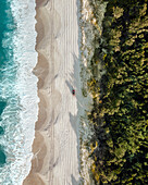 Aerial view of a car driving on the beach,Bribie Island,Queensland,Australia. Top down perspective