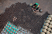 Sahajanpur,Bangladesh - 19 December 2021: Aerial view of a person working with clay pots in a factory,Bangladesh