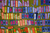 Aerial view of people working in a public laundry draining and drying colourful clothes at sunlight,Araihazar,Dhaka province,Bangladesh