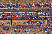 Aerial view of a large congregation of people for a muslim festival on the top of trains at train station in Dhaka,Bangladesh