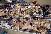 Dhaka,Bangladesh - 04 August 2021: Aerial view of people trading and sailing using long fishing canoes along Kaliganga river,Ghior,Dhaka province,Bangladesh