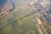 Aerial view of a building site while assembling the Padma bridge,the longest rail and highway bridge in Bangladesh crossing the Padma river,Zajira,Dhaka,Bangladesh