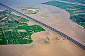 Aerial view of Padma bridge,over the padma river by day in lateral perspective,Shibchar,Dhaka,Bangladesh