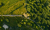 Aerial view of the top of a stepped hill illuminated by late afternoon light in the Po Valley,Italy