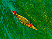 Badalgachhi,Bangladesh - 30 January 2021: Aerial view of fishermen on a canoe sailing the Jamuna river,Bangladesh