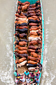 Narayanganj,Bangladesh - 19 July 2021: Aerial view of cattle squeezed on a boat crossing the river in Narayanganj,Bangladesh