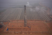 Aerial view of a brick factory from above,people working arranging the bricks near Keraniganj township,Dhaka province,Bangladesh