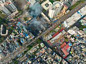 Aerial view of Firefighters and mass people were working to douse the massive fire in the capital city Dhaka,Bangladesh