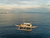 Aerial view of single filipino fishing boat near Lapu-Lapu city,Philippines