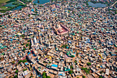 Aerial view of people celebrating the holy colour festival near the Shri And Baba Temple,Uttar Pradesh,India