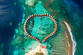 Aerial view of a beautiful luxury resort at sunset on Alifu Dhaalu Atoll in North Central Province in the middle of the Ocean,Alif ALif,Maldives