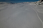 Aerial view of cross country skiers on snowy tracks in a serene alpine landscape,Skammestein,Norway