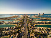 Aerial view of the Palm Jumeirah with Atlantis the Palm luxury hotel in background,an artificial archipelagos in the city centre of Dubai,United Arab Emirates