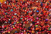 Nandgaon,India - 01 March 2023: Aerial view of people celebrating the holy colour festival at Shri And Baba Temple,Uttar Pradesh,India