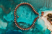 Aerial view of a beautiful luxury resort at sunset on Alifu Dhaalu Atoll in North Central Province in the middle of the Ocean,Alif ALif,Maldives