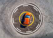 Aerial view of a car parked in the middle of an helipad in Dubai,U.A.E