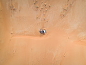 Aerial view above of abandoned car in the middle of desert,U.A.E