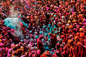 Nandgaon,India - 01 March 2023: Aerial view of people celebrating the holy colour festival at Shri And Baba Temple,Uttar Pradesh,India