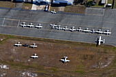 Aerial view of a busy airport with parked airplanes and a runway,Caloundra West,Queensland,Australia