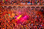 Nandgaon,India - 01 March 2023: Aerial view of people celebrating the holy colour festival at Shri And Baba Temple,Uttar Pradesh,India