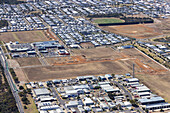 Aerial view of organized suburban development with residential and commercial areas,Ocean Grove,Australia