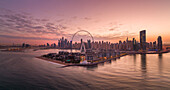 Panoramic Aerial view of Dubai skyline at sunset with Ain Dubai in foreground,the world's largest Ferris wheel,Dubai,United Arab Emirates