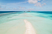 Aerial view of a woman walking on Long Beach Dhigurashu Thundi,a tropical island and beach on Alifu Dhaalu Atoll,Alif,Alif,Maldives