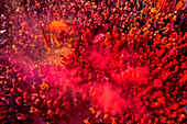 Nandgaon,India - 01 March 2023: Aerial view of people celebrating the holy colour festival at Shri And Baba Temple,Uttar Pradesh,India